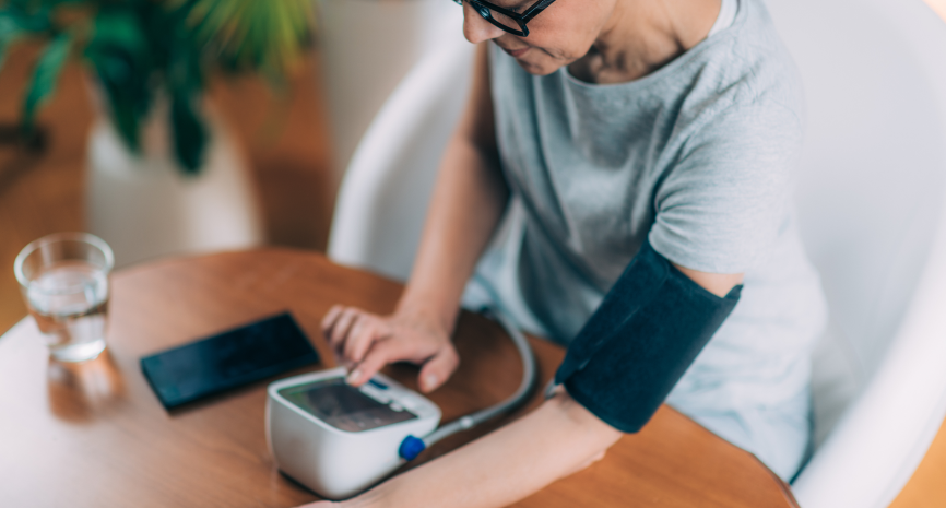 woman taking her blood pressure